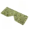 Masque yeux en jade naturel JadeZen ™ posé sur un plan.